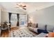 Cozy living room featuring hardwood floors, neutral decor, and a ceiling fan for comfortable living at 2252 S Lafayette St, Denver, CO 80210