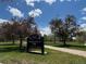 Sign for Harvard Gulch Park near the property, with lush trees and a walking path on a sunny day at 2252 S Lafayette St, Denver, CO 80210