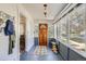 Inviting sunroom with a patterned rug, and views of the outdoors, offering a relaxing space at 2252 S Lafayette St, Denver, CO 80210