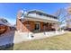 Backyard features a covered patio area perfect for entertaining and outdoor dining at 9202 W Virginia Pl, Lakewood, CO 80226