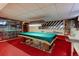 Finished basement featuring a pool table, mirrored walls and carpeted floors at 9202 W Virginia Pl, Lakewood, CO 80226