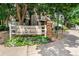 Welcome to Arrowhead, with beautifully landscaped signage and lush surroundings for a serene neighborhood entrance at 8055 E Colorado Ave # 8, Denver, CO 80231