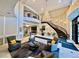Elegant lobby featuring a grand staircase, chandelier, and comfortable seating area at 1827 N Grant St # 1104, Denver, CO 80203