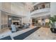 Elegant lobby with a fireplace, seating area, and access to elevators at 1827 N Grant St # 1104, Denver, CO 80203