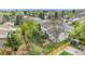 Aerial view of home showcasing fenced backyard, mature trees, deck, and surrounding neighborhood at 92 Helena Cir, Littleton, CO 80124