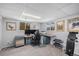 Versatile basement with a home office setup and fitness equipment at 92 Helena Cir, Littleton, CO 80124
