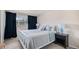 Cozy bedroom with neutral tones, a white bed frame, and natural lighting at 92 Helena Cir, Littleton, CO 80124