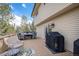 View of outdoor deck featuring a grill, dining furniture, and comfortable chairs for relaxing outside at 92 Helena Cir, Littleton, CO 80124