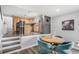 Open concept eat-in kitchen with stainless appliances, next to an eat-in dining area at 92 Helena Cir, Littleton, CO 80124