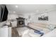 Cozy living room with a stone fireplace, built-in shelves, and a comfortable sectional sofa at 92 Helena Cir, Littleton, CO 80124