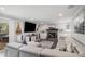 Bright living room features a fireplace, recessed lighting, and walkout to deck at 92 Helena Cir, Littleton, CO 80124