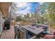 Outdoor deck features a fire pit, comfortable seating, and scenic views at 92 Helena Cir, Littleton, CO 80124