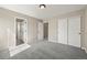 Spacious bedroom with neutral walls, carpet floors, and closet, offering a calming retreat at 19782 W 59Th Ave, Golden, CO 80403