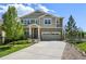 Attractive two-story home featuring a covered porch and attached two-car garage at 19782 W 59Th Ave, Golden, CO 80403