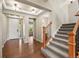 Inviting foyer with hardwood floors and a staircase leading to the upper level at 19782 W 59Th Ave, Golden, CO 80403