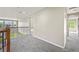 Upstairs hallway with neutral colored carpet, white baseboards and decorative wood and metal railing overlooking the entry at 19782 W 59Th Ave, Golden, CO 80403
