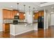 Well-equipped kitchen with wood cabinets, granite countertops, and a black appliance package at 19782 W 59Th Ave, Golden, CO 80403