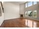 Bright living room with a fireplace and hardwood flooring at 19782 W 59Th Ave, Golden, CO 80403