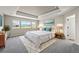Spacious main bedroom with tray ceiling, plush carpet and plenty of light from the three windows at 19782 W 59Th Ave, Golden, CO 80403