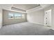 Large main bedroom features a trey ceiling, plush carpet and plenty of light from the three windows at 19782 W 59Th Ave, Golden, CO 80403