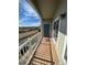 Balcony with wooden deck overlooking neighborhood and street at 2705 S Danube Way # 304, Aurora, CO 80013