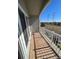 Balcony with wooden deck overlooking neighborhood at 2705 S Danube Way # 304, Aurora, CO 80013