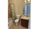 Bathroom includes tile floors, shower-tub combo, and a vanity with cabinet at 2705 S Danube Way # 304, Aurora, CO 80013