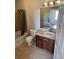 Bathroom with shower, tile, vanity, and a large mirror at 2705 S Danube Way # 304, Aurora, CO 80013