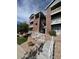 A beautiful brick building with a well-maintained lawn and stairs with white railings at 2705 S Danube Way # 304, Aurora, CO 80013