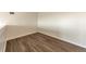 Neutral loft space featuring wood-look flooring and neutral walls at 4866 S Dudley St # 9, Littleton, CO 80123