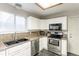 Modern kitchen with stainless steel appliances, ample counter space, and stylish backsplash at 12222 N Ivanhoe Cir, Brighton, CO 80602