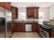 Well-equipped kitchen featuring custom wood cabinetry, stainless steel appliances, and granite countertops for a modern touch at 1615 Locust St, Denver, CO 80220