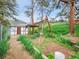 Charming backyard featuring a swing set, shed, and beautiful landscape, perfect for outdoor activities at 6094 Pyrenees Trl, Golden, CO 80403
