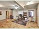 Finished basement area with a wood-burning stove, tile flooring, and office space at 6094 Pyrenees Trl, Golden, CO 80403