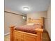 Cozy bedroom with neutral walls and a wooden bed frame at 6094 Pyrenees Trl, Golden, CO 80403