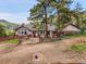 Charming single-Gathering home with a rustic exterior and mature trees at 6094 Pyrenees Trl, Golden, CO 80403