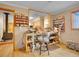 Home office space featuring wood floors and two windows for natural light at 6094 Pyrenees Trl, Golden, CO 80403