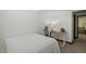 Bright basement bedroom with built-in workspace and adjacent bathroom at 2103 Ranch Dr, Westminster, CO 80234