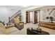 Finished basement with seating area and access to laundry at 2103 Ranch Dr, Westminster, CO 80234