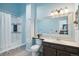 Clean bathroom with shower/tub combo and updated vanity at 2103 Ranch Dr, Westminster, CO 80234