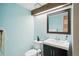 Updated bathroom with light blue walls and modern vanity at 2103 Ranch Dr, Westminster, CO 80234