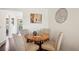 Small round dining table with four chairs in a bright area at 2103 Ranch Dr, Westminster, CO 80234