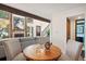 Bright dining room with wood table and chairs, access to backyard at 2103 Ranch Dr, Westminster, CO 80234