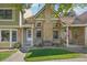 Charming two-story townhome with landscaping and a front porch at 2103 Ranch Dr, Westminster, CO 80234