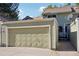 Attached garage with automatic door opener at 2103 Ranch Dr, Westminster, CO 80234