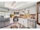 Modern kitchen with stainless steel appliances and ample counter space at 2103 Ranch Dr, Westminster, CO 80234