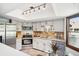 Modern kitchen with stainless steel appliances and track lighting at 2103 Ranch Dr, Westminster, CO 80234