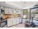Updated kitchen with stainless steel appliances and a breakfast nook at 2103 Ranch Dr, Westminster, CO 80234