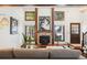 Vaulted ceilings and a stone fireplace highlight this living room at 2103 Ranch Dr, Westminster, CO 80234