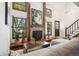 Bright living room with vaulted ceiling, fireplace, and hardwood floors at 2103 Ranch Dr, Westminster, CO 80234